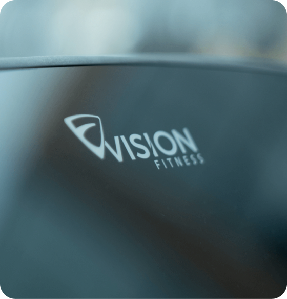 Zoomed in image of the Vision Fitness logo on a console screen at an angle